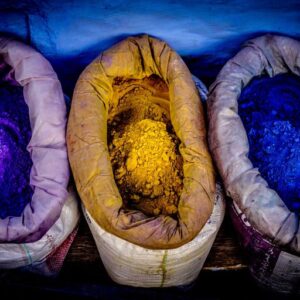 PepsiCo is evaluating different natural color ingredients and technologies for multiple food and beverage brands.-Image of yellow, purple and blue pigments in bags