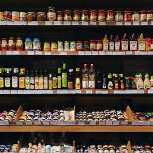 Seeking: Companies to Carry Out Shelf Life Studies for Food Products.-Image of condiments and other food products on a grocery store shelf
