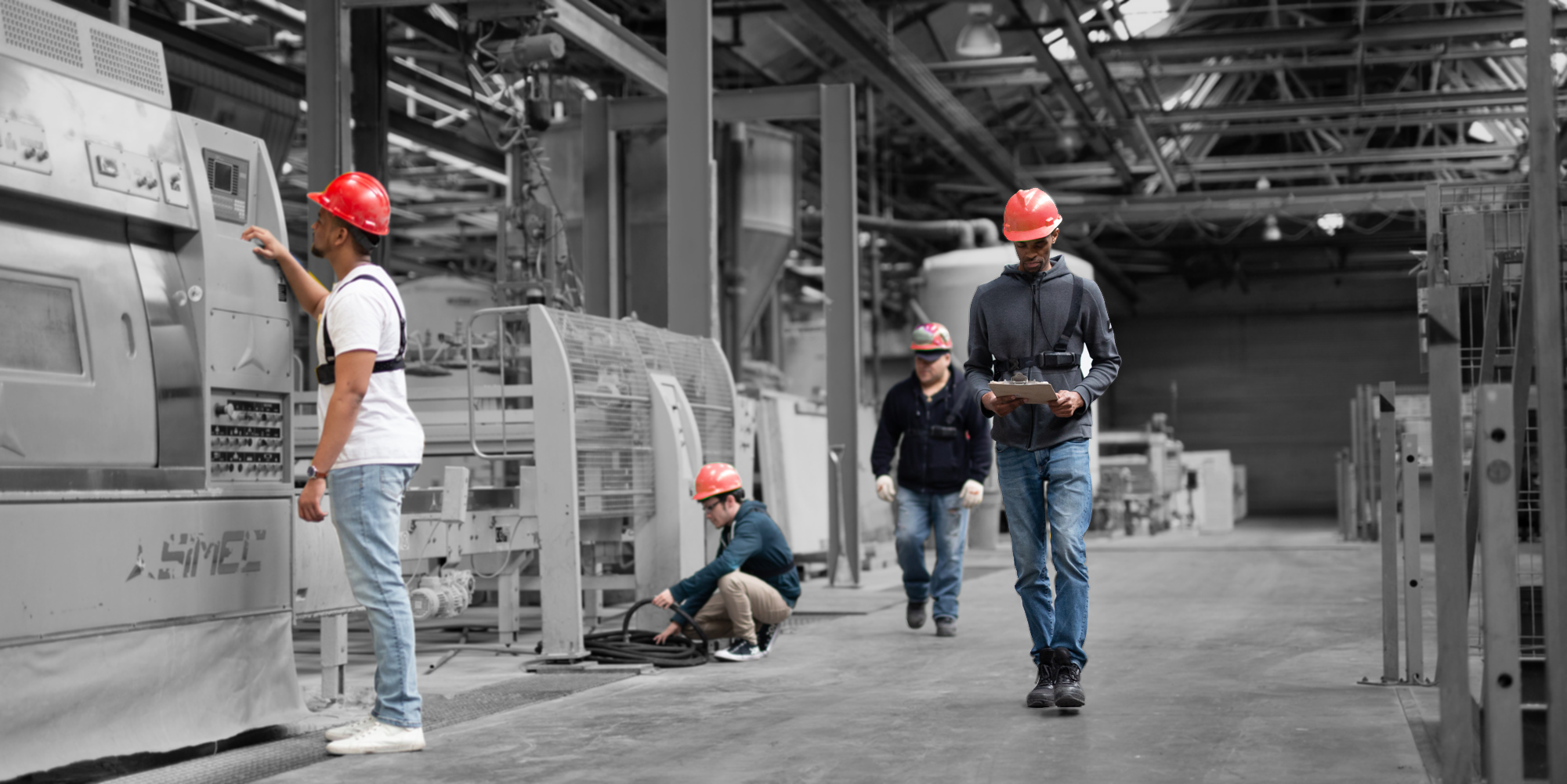 StrongArm Offering: Wearable to Improve Worker Safety-Image of workers in a factory wearing the FUSE Risk Management Platform