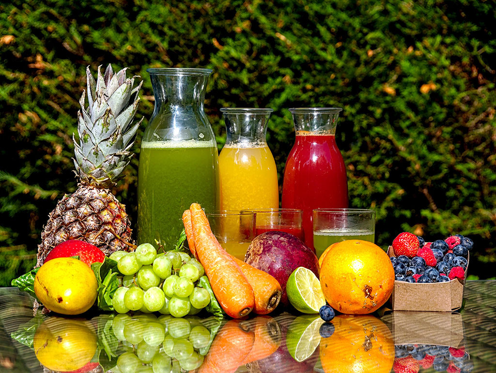 Seeking: LATAM Fruit Juice, Honey & Syrup Industrial dehydration Technologies-Fruit and Juice arranged on a table