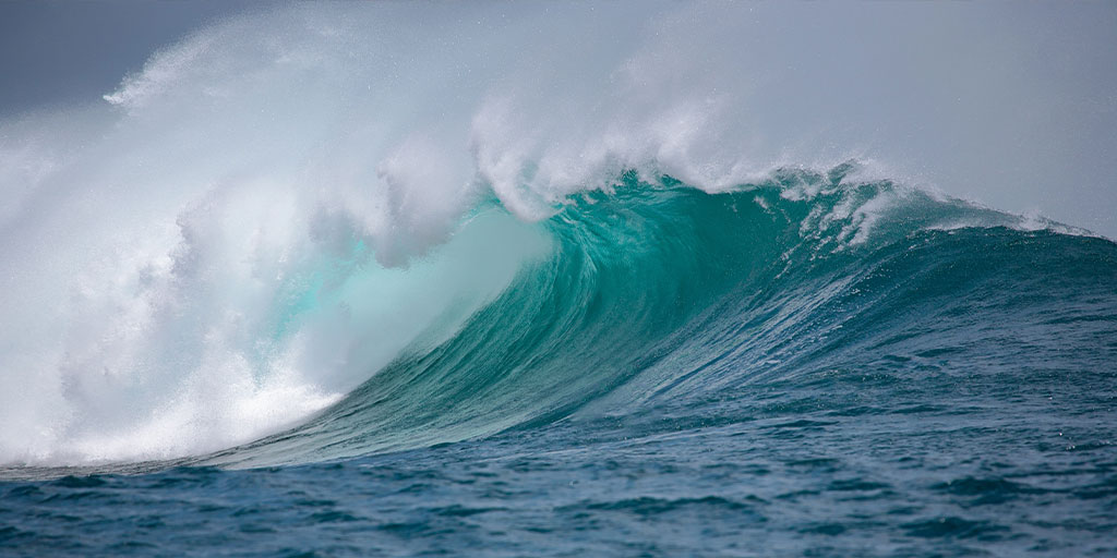 Seeking: Flexible Energy Conversion Tech to Harvest Wave Energy-Image of a pitching left facing wave in tropical water breaking towards the left from the shoulder