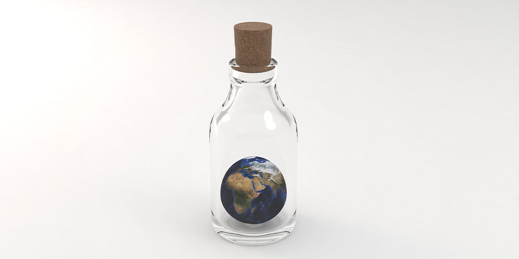 PepsiCo Seeking: GHG Gas Reduction for Packaging: Image of the earth in a glass bottle with a cork on a white background